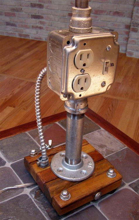 pipe lamp with electrical outlet